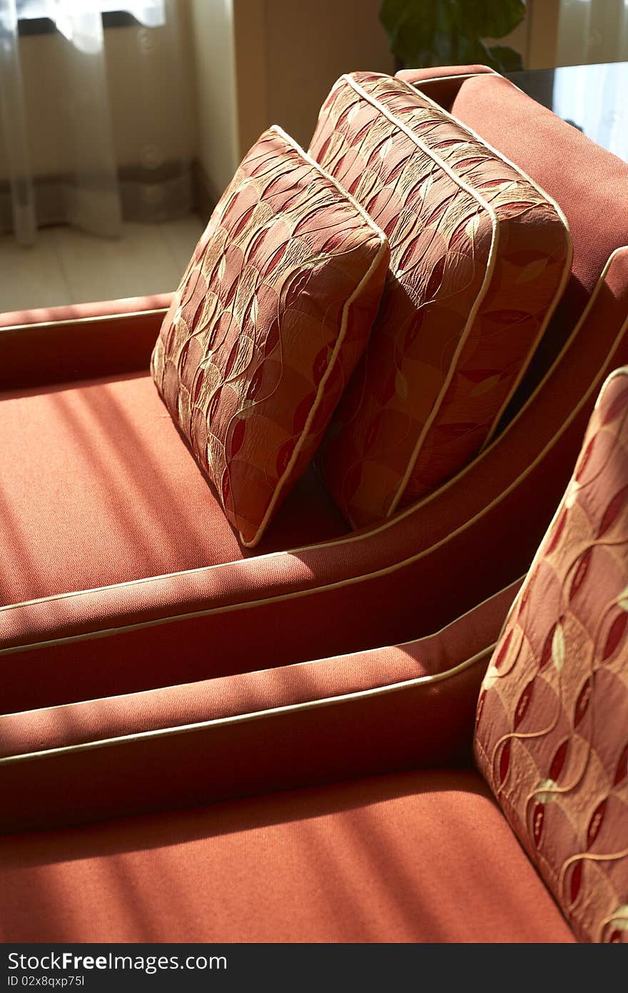 A sun drenched seat in a hotel. A sun drenched seat in a hotel.