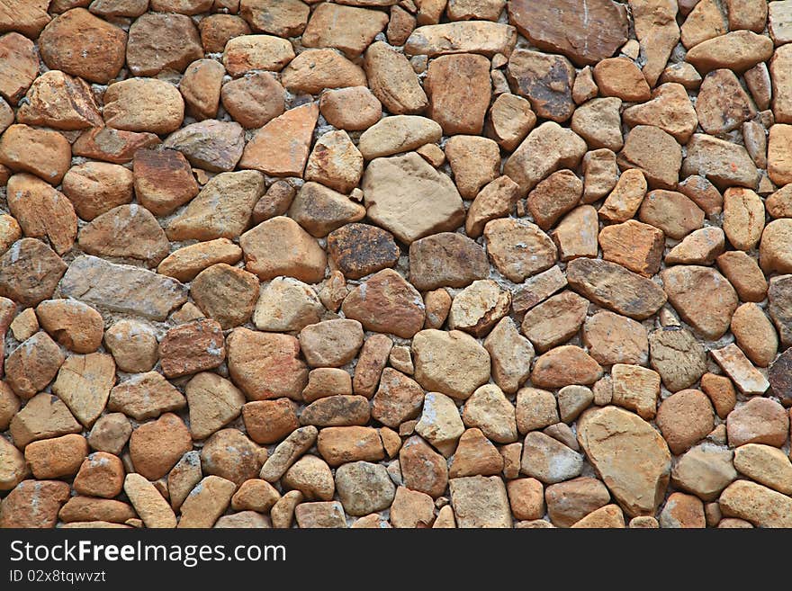 Traditional Stone Brick Wall made of fragment stones in irregular shapes. Traditional Stone Brick Wall made of fragment stones in irregular shapes