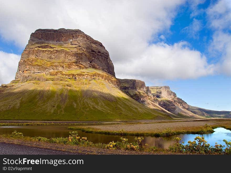 Mountain and lake lit by the setting sun in Iceland. Mountain and lake lit by the setting sun in Iceland