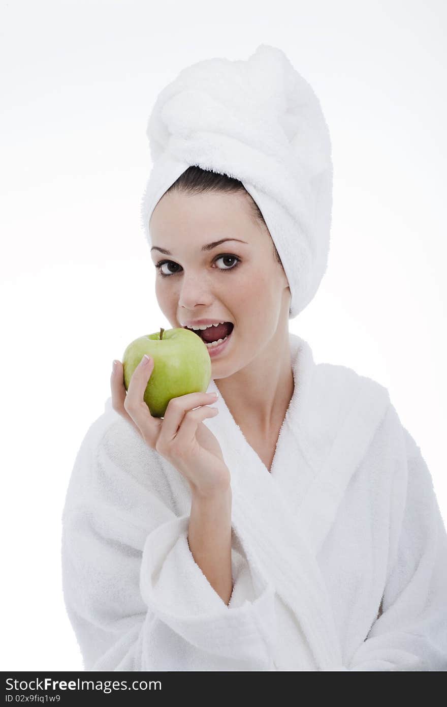 Beauty in bathrobe with a green apple. Beauty in bathrobe with a green apple