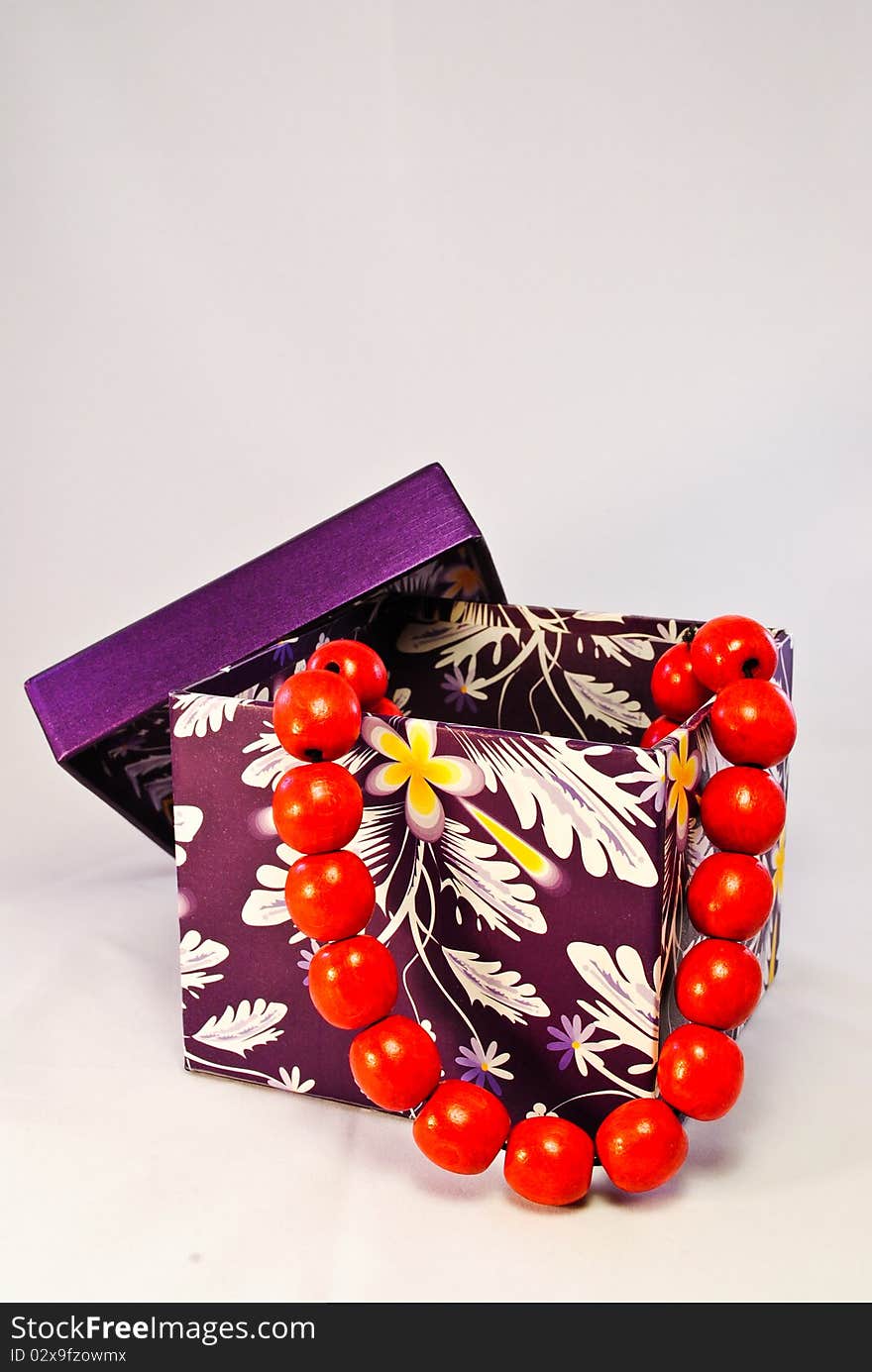 Purple Gift Box With Red Beads