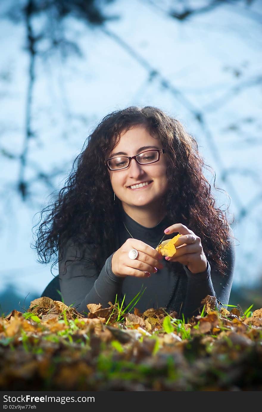 Young woman on autumn grass with evening light. Young woman on autumn grass with evening light