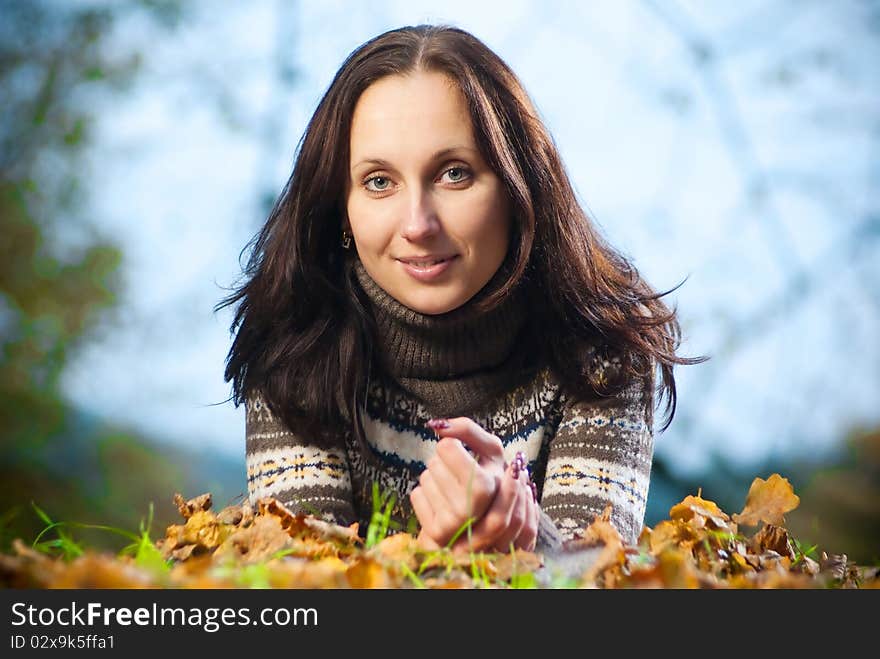 Pretty woman on autumn meadow with evening light