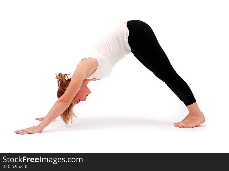 Beautiful girl practicing yoga on isolated white background