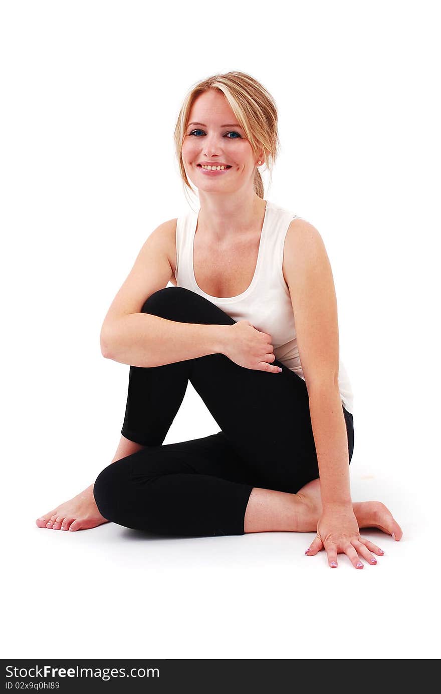 Beautiful girl practicing yoga on isolated white background