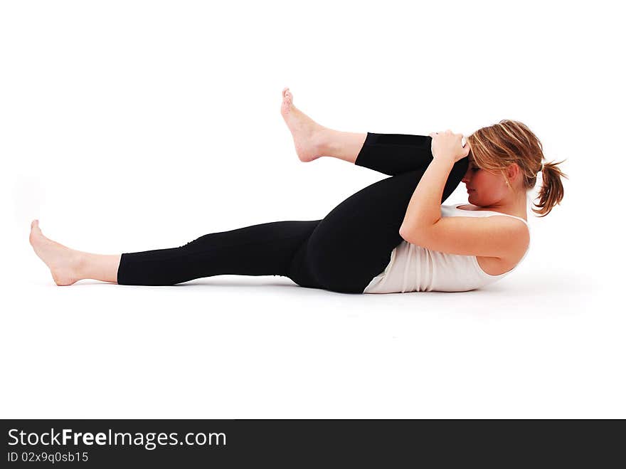 Beautiful girl practicing yoga on isolated white background