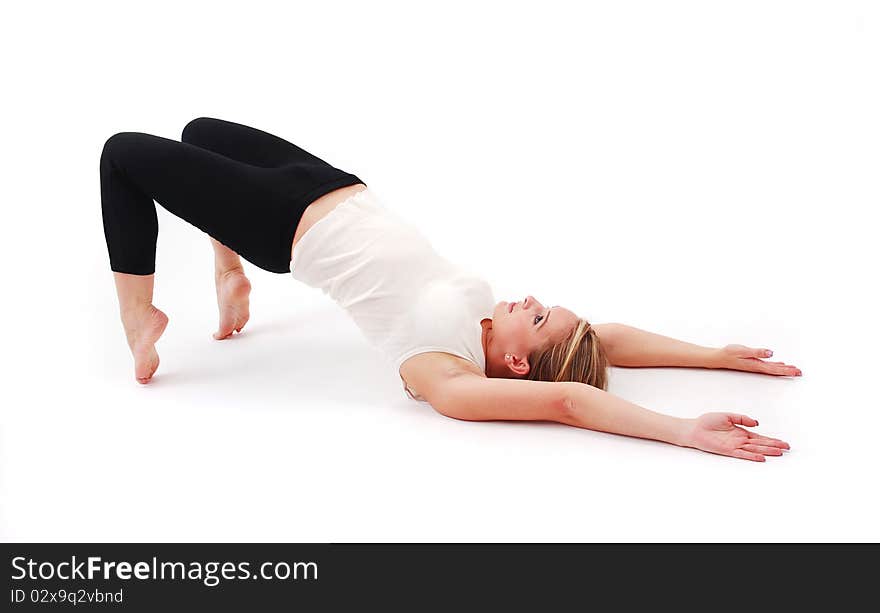 Beautiful girl practicing yoga on isolated white background