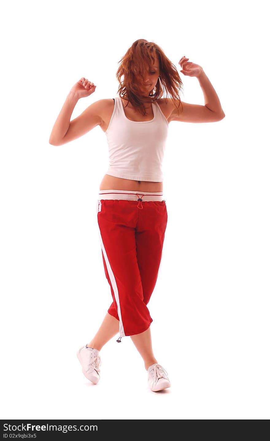 Attractive teenage dancing over white background