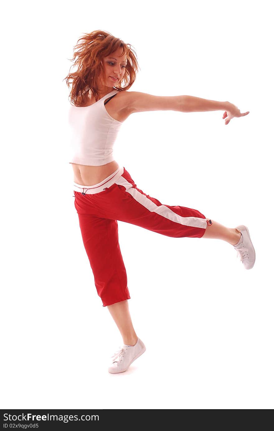 Attractive teenage dancing over white background