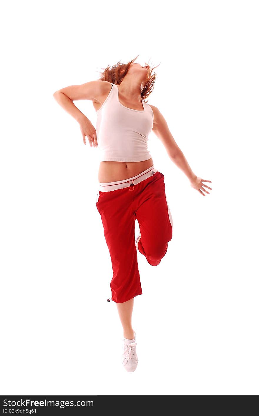 Attractive teenage dancing over white background