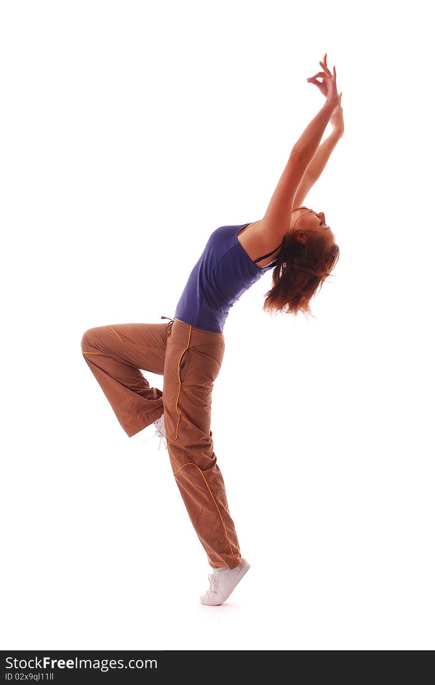 Attractive teenage dancing over white background