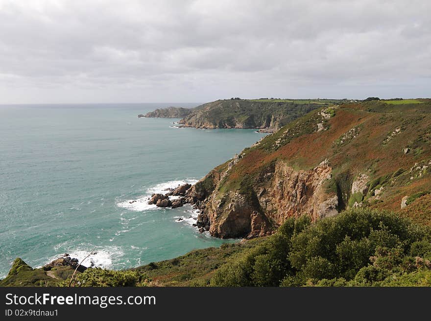 View to LeGouffre and cliffs at Petit Bot Bay from Icart Point on Guernsey