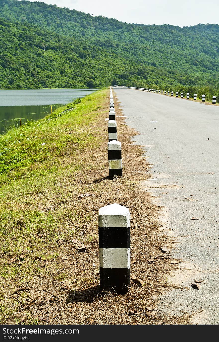 Row of cement poles on the dam