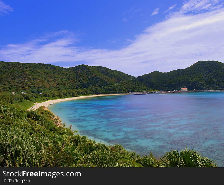 Beautiful beach surrounded by tropical hills on one side and the ocean on the other. Beautiful beach surrounded by tropical hills on one side and the ocean on the other.