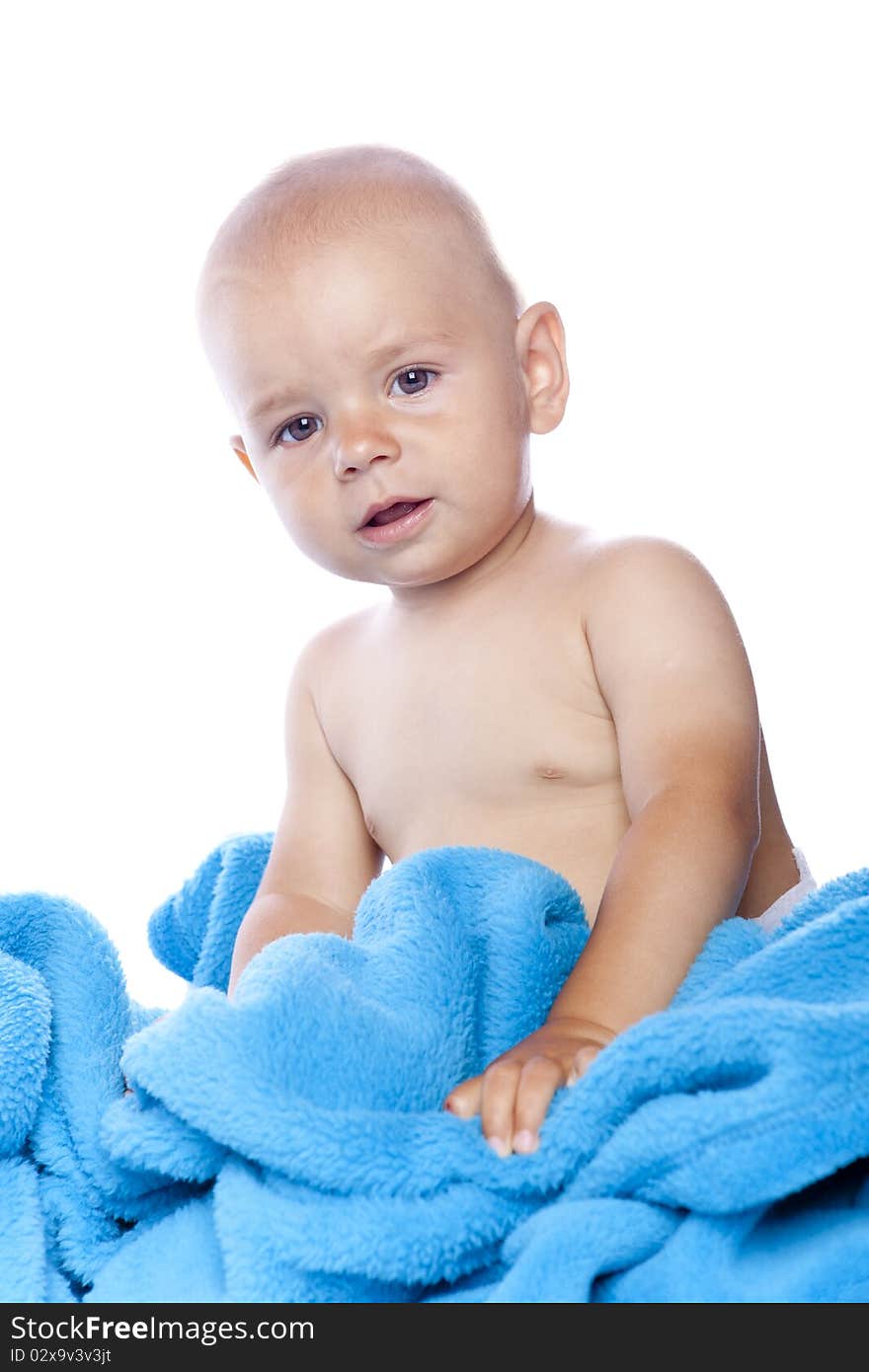 A beautiful baby with blue towel on white