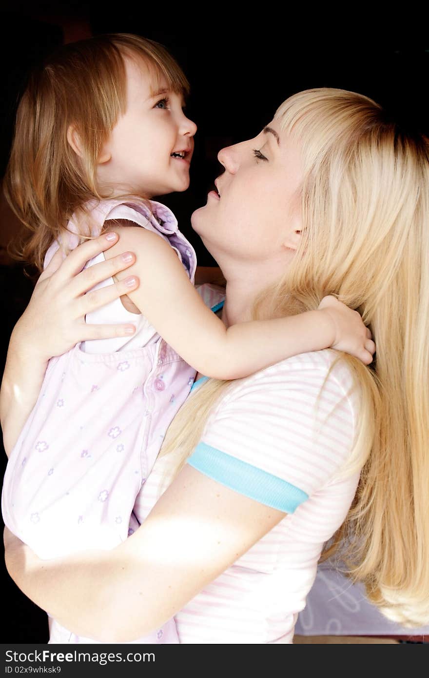 Portrait of loving mother and daughter