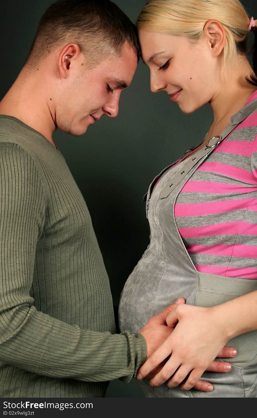 Beautiful young couple waiting baby