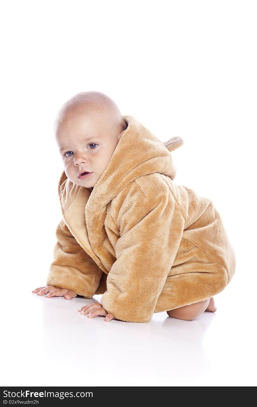 Cute little boy with a warm coat on white background