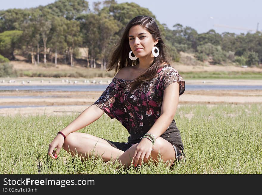 Beautiful girl with floral dress meditating on the nature. Beautiful girl with floral dress meditating on the nature.