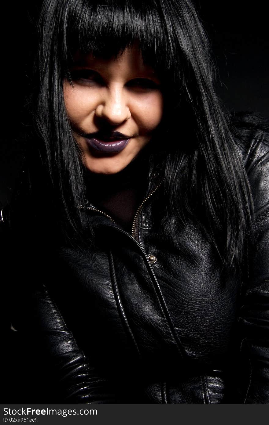 Portrait of smiling gothic woman with black hair. Portrait of smiling gothic woman with black hair