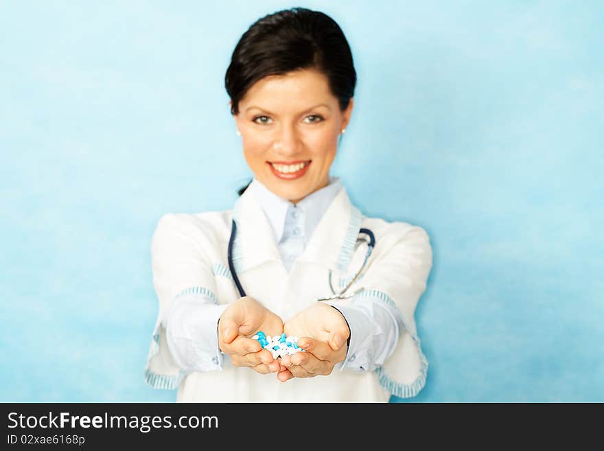 Caucasian woman as a doctor holding meds