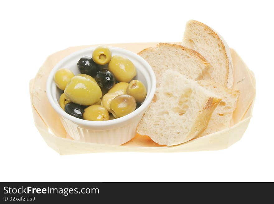 Olives and chunks of bread in a wooden basket. Olives and chunks of bread in a wooden basket