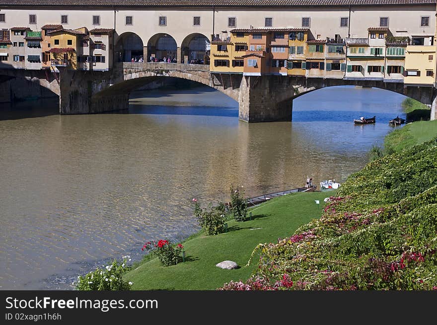 The Ponte Vecchio is a Medieval bridge over the Arno River, in Florence, Italy, noted for still having shops built along it, as was once common.