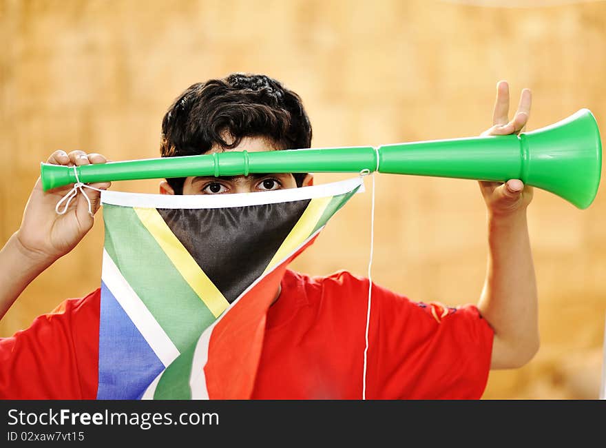 Encourager with vuvuzela and flag