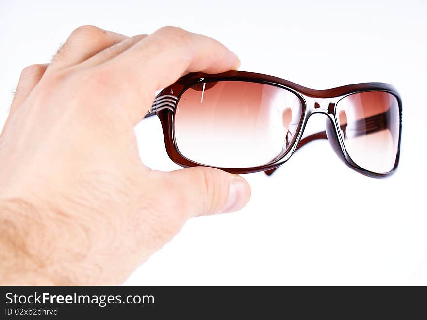 glases in hand on white background