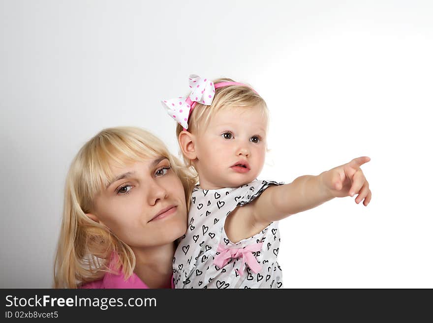 Beautiful child girl playing with toys and her mother. Beautiful child girl playing with toys and her mother