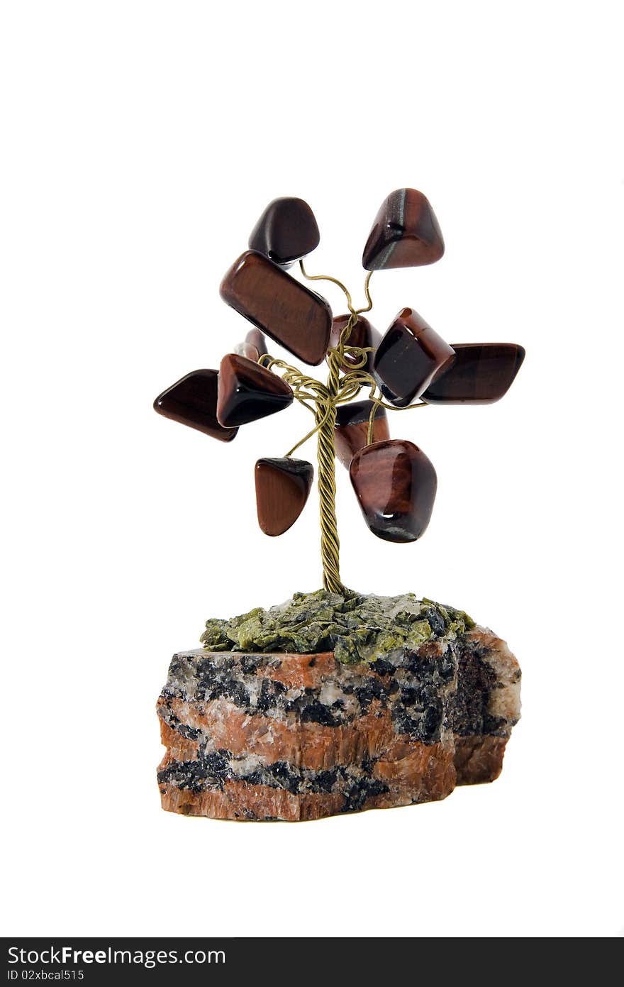 Tree on the white background, made of the present stones. Tree on the white background, made of the present stones