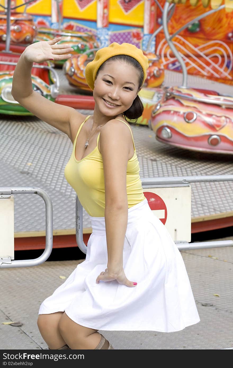 Happy girl walking in amusement park