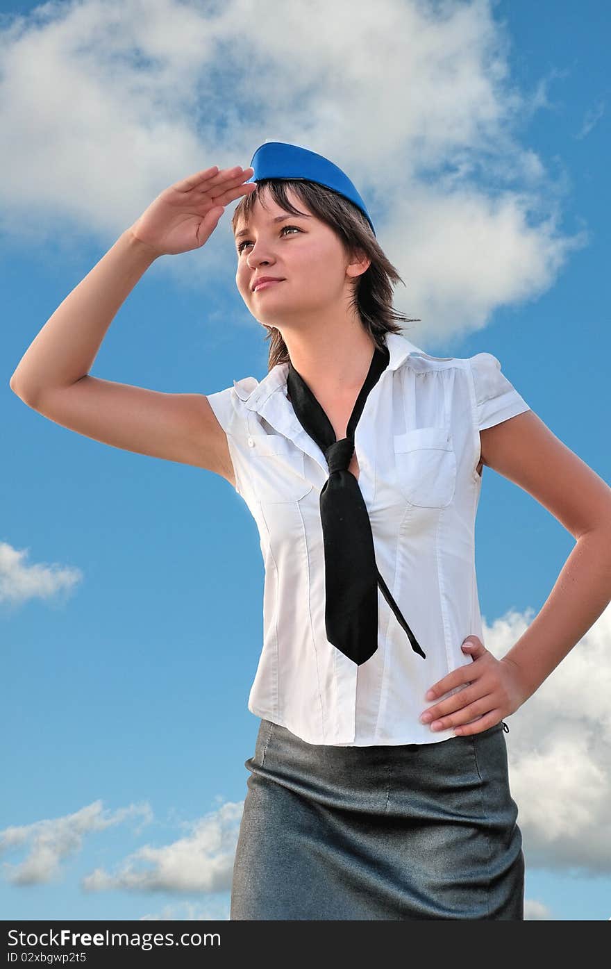 Attractive woman stewardess looks into the distance