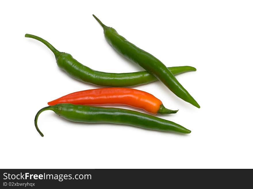 Green and orange chili pepper on white background. Green and orange chili pepper on white background