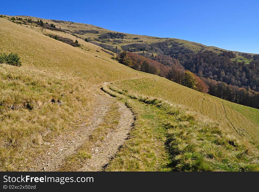 Soil road on a hillside.