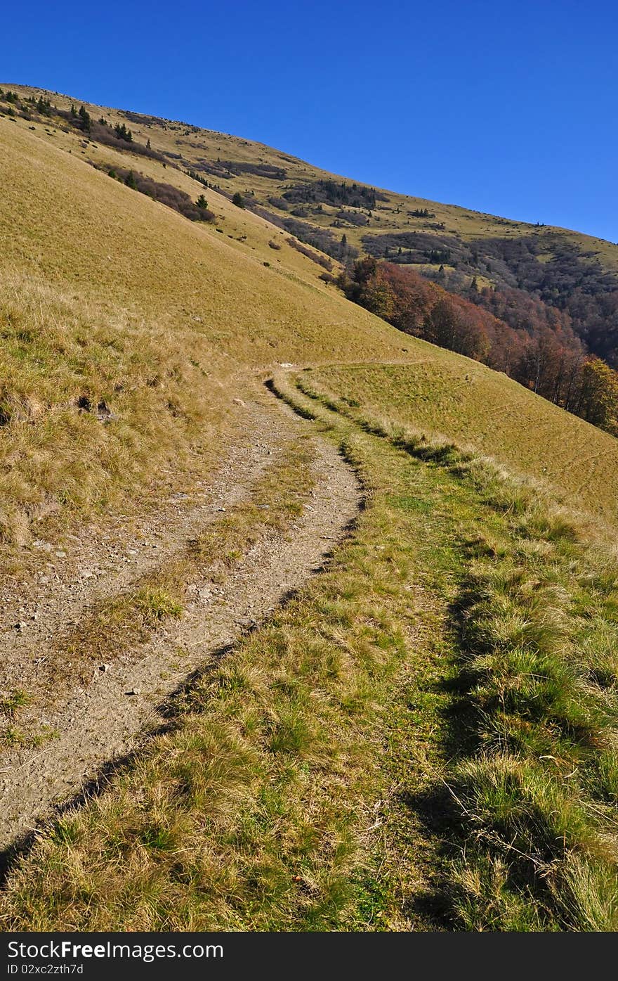 Soil road on a hillside.