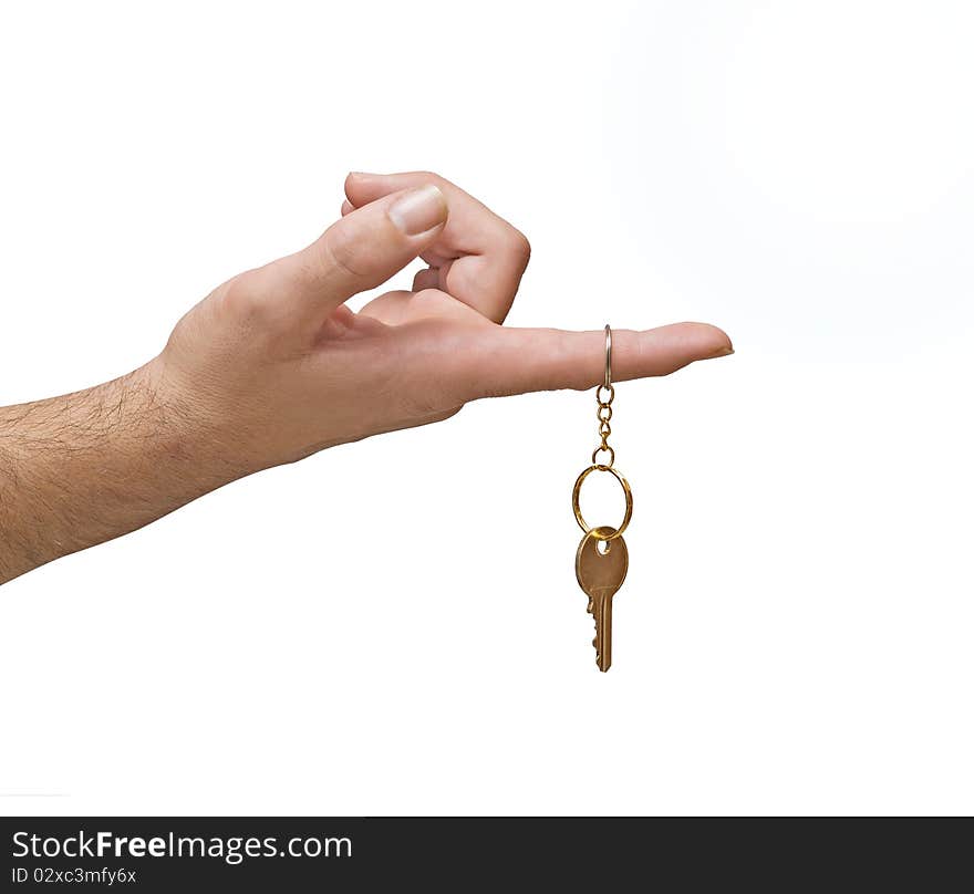 Close up of hand holding key isolated on background