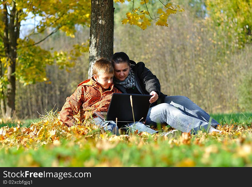 Kid And Woman With Notebook