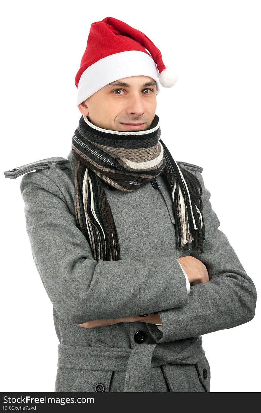 Handsome young man in santa hat isolated on a white