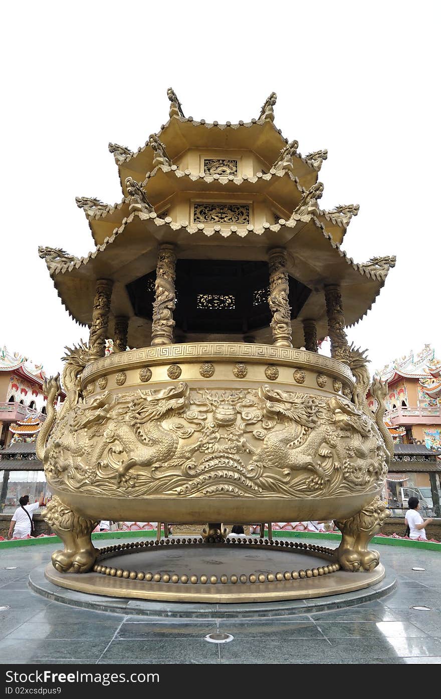 Huge golden incense burner in chinese temple.