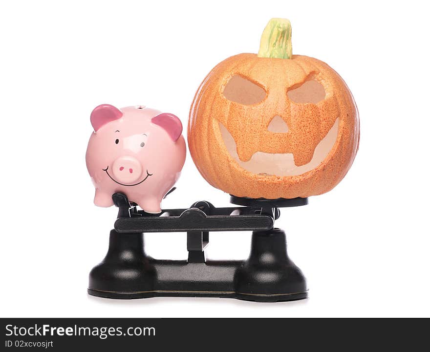 Piggybank And Pumpkin On Scales