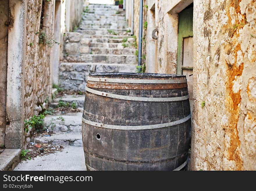 Cedar barrel in a narrow street