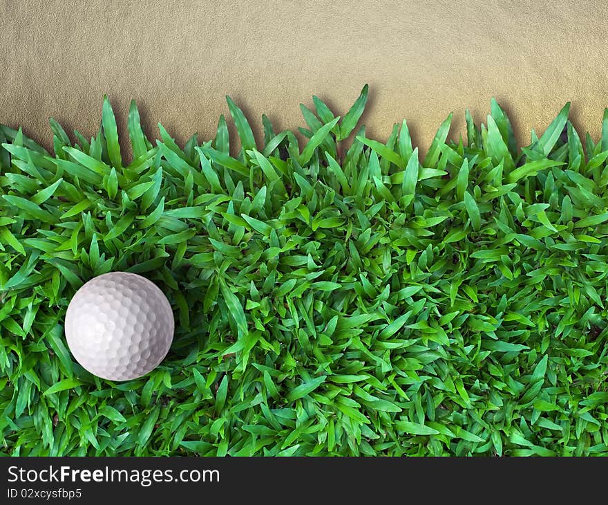 Golf Ball on Green Grass and Sand