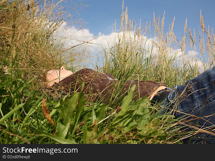 Young woman is in the grass