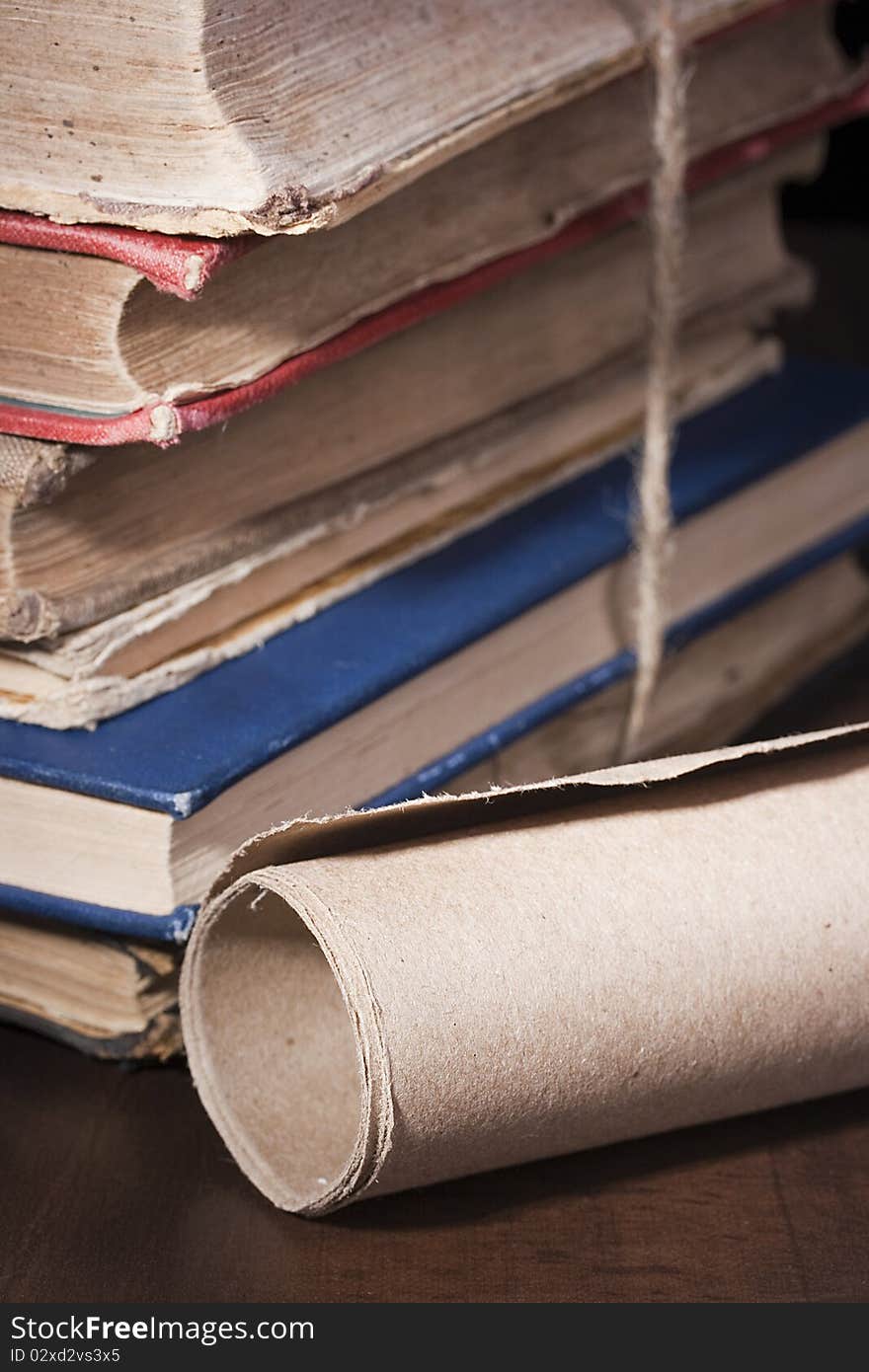 Antiquarian books in a library book-depository are combined by a pile. Antiquarian books in a library book-depository are combined by a pile.