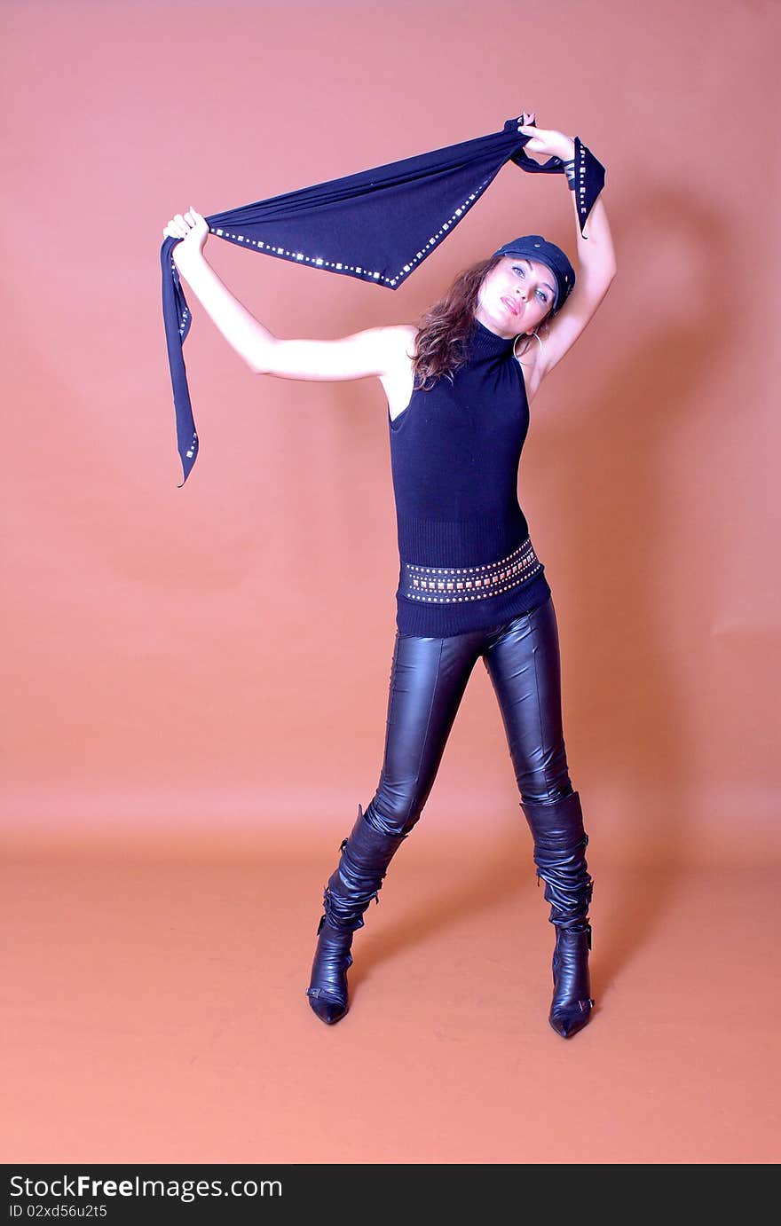 Portrait of fashion model wearing leather pants