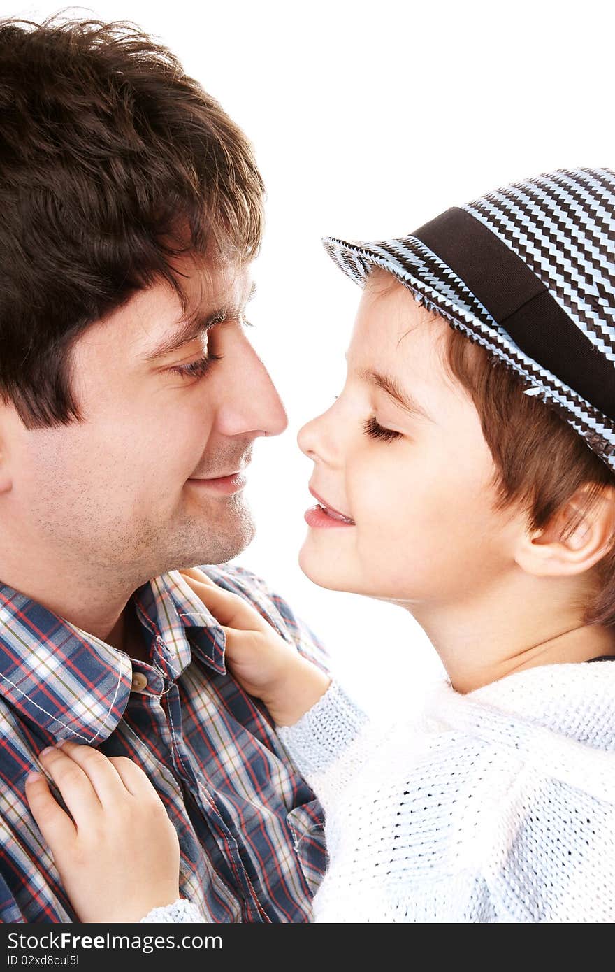 Portrait of young attractive smiling man playing with his little cute son on white background. Portrait of young attractive smiling man playing with his little cute son on white background