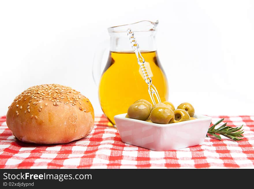 Olive oil, green olives and bread