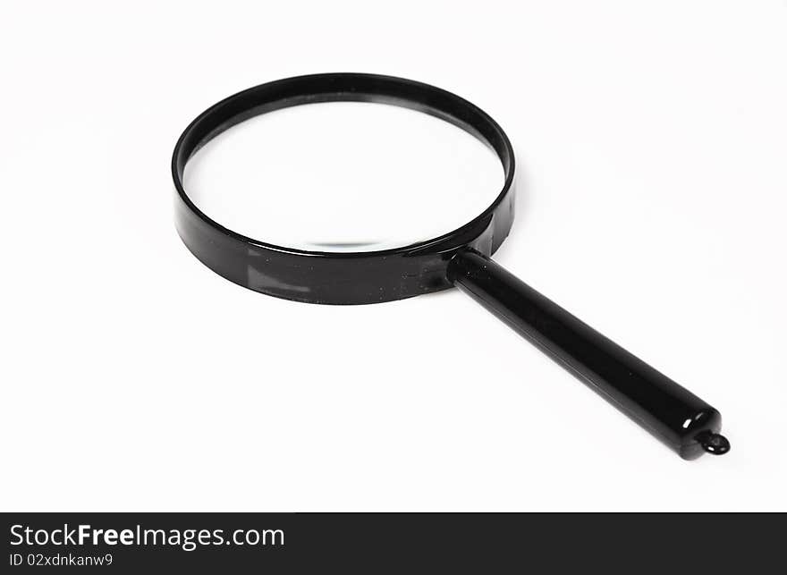 Magnifying glass over white background