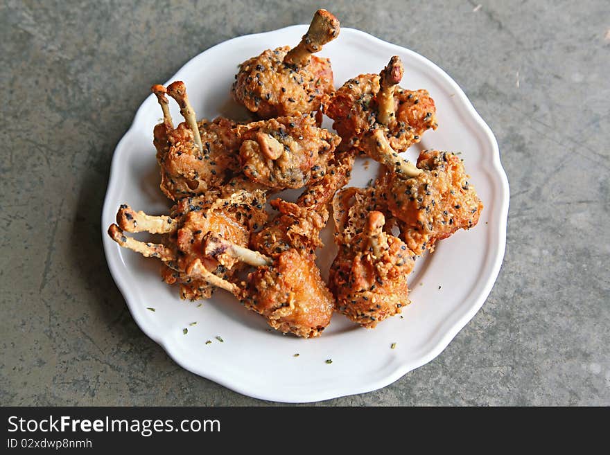 Deep fried chicken on white basil